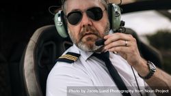 Mature helicopter pilot with headset 0LdP2P