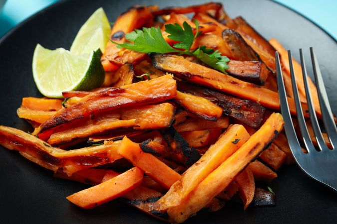 Concept of tasty food, fried sweet potato, close up