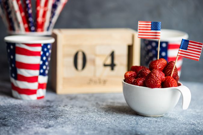 Bowl of strawberries with little USA flags for Independence Day