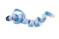 Measuring tape isolated on light background. Weight loss