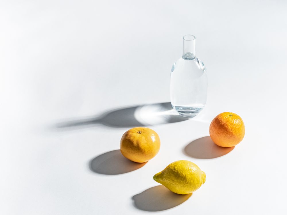 Composition of citrus and jar of water
