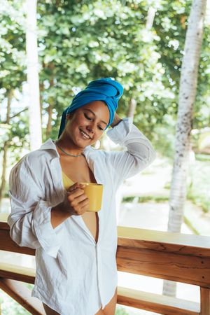 Woman in turban drinking coffee