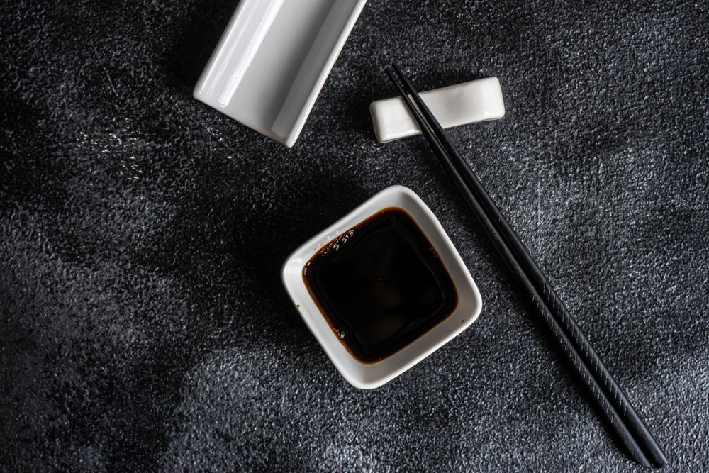 Dark Asian table setting with chopsticks