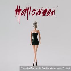 Doll in dress with skull head with “Halloween” text 4BqlW5