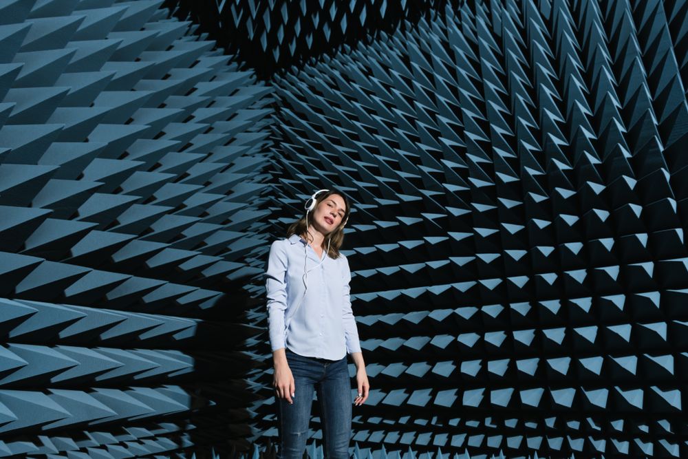 Woman in sound room listening to music