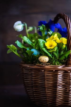Basket of flowers with decorative eggs