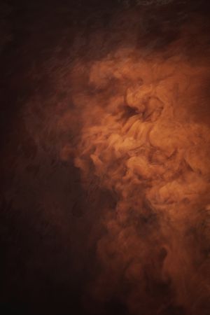 Smoke over water in brown light