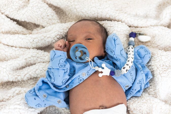 Newborn baby on soft blanket