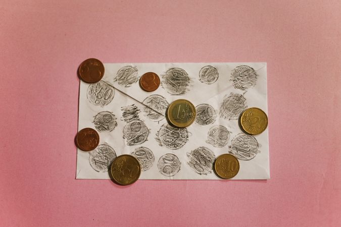 Euro coins stencils on envelope