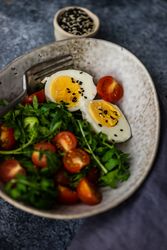 Bowl of healthy salad with hard boiled egg