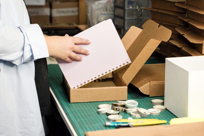 Packing goods in cardboard boxes