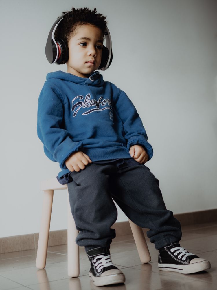Black child listening to music