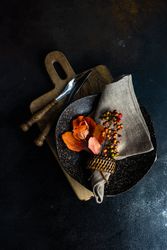 Top view of autumnal table setting with orange leaves