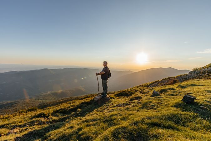 Older man posing on the mountain