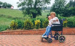 Granddaughter hugging her grandmother
