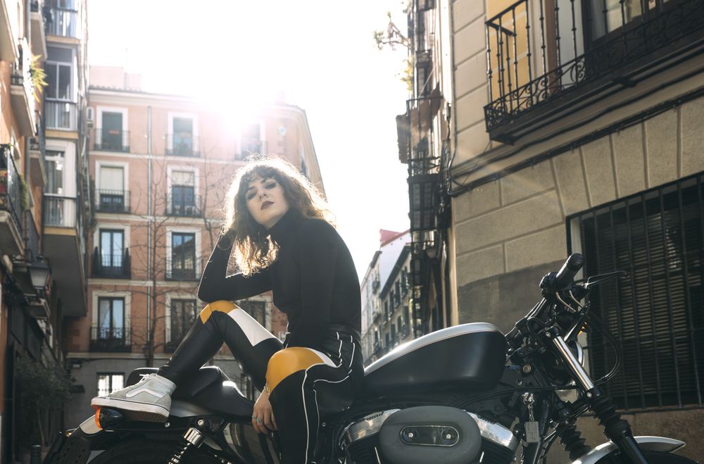 Young woman in custom motorbike
