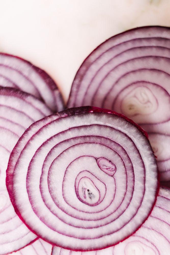 Slices of onion on tabletop