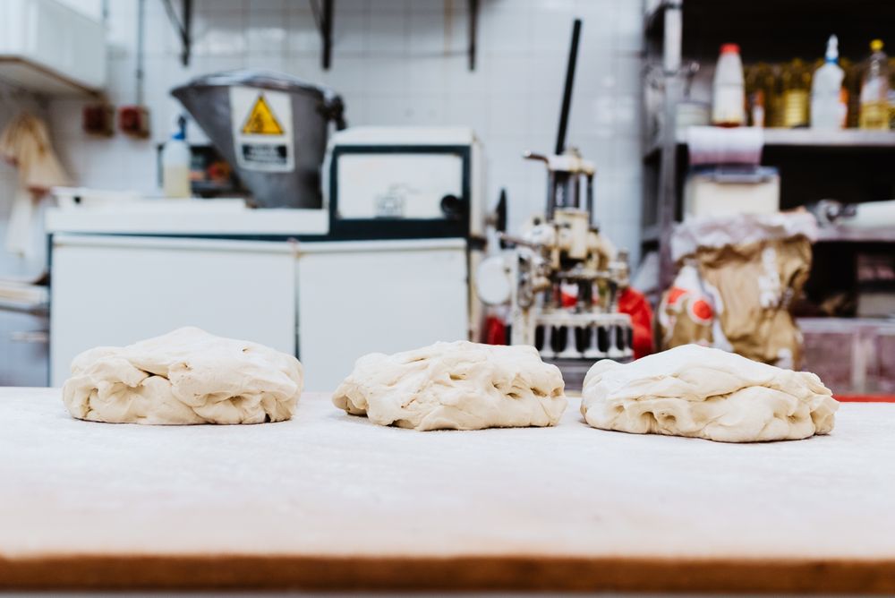 Soft dough on bakery table