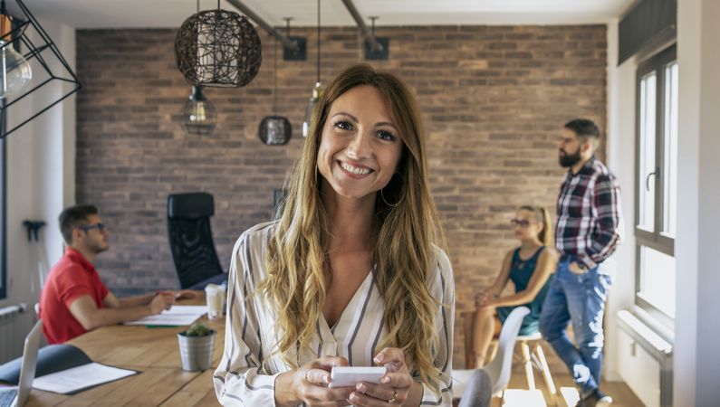 Businesswoman with mobile at the office