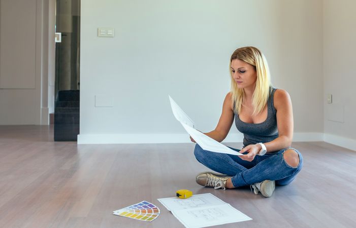 Woman looking house plans