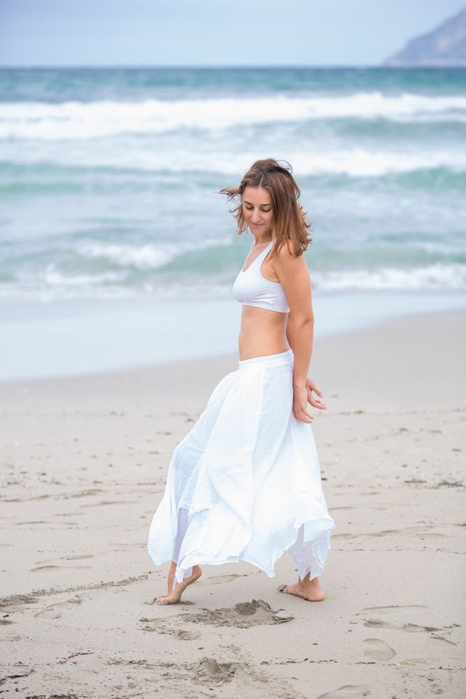 woman dancing near sea