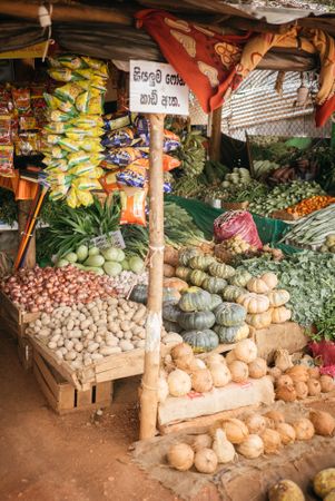 Squash, potatoes, coconuts and chips for sale at Sri Lankan market