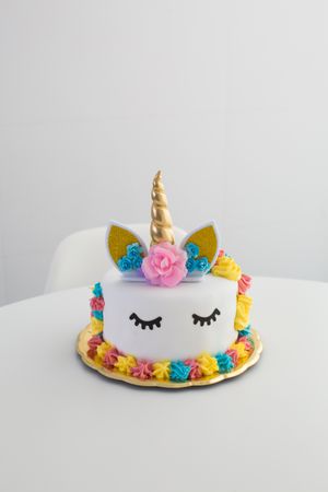 Cute unicorn cake with painted closed eyes