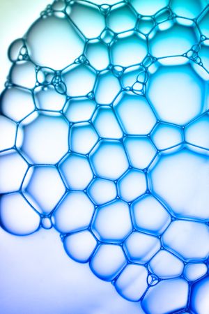 Abstract background bio technology, macro photography foam and water with gradient background. Molecule multicolor backgorund