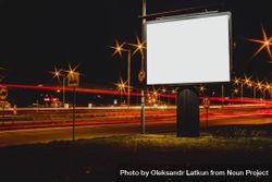 Blank advertisement billboard with blurred traffic lights night 0PY7m5