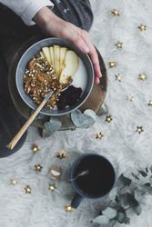 Faceless woman taking healthy breakfast bowl