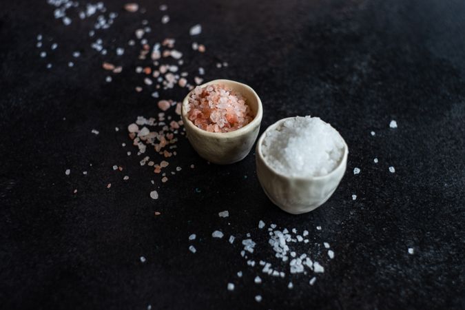 Two bowls of salt on counter