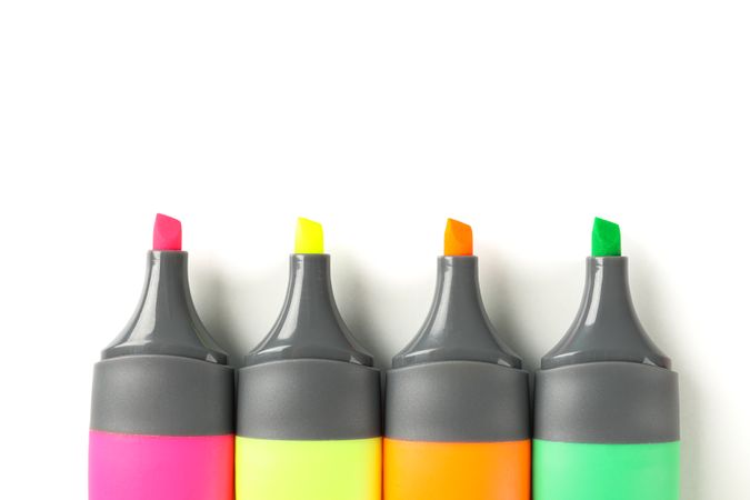 Color office highlighters isolated on plain background, top view
