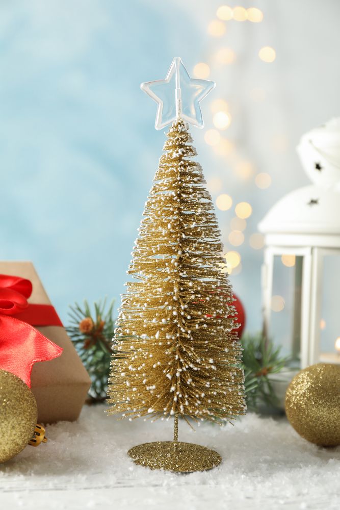 Christmas lantern and tree on decorated background, space for text