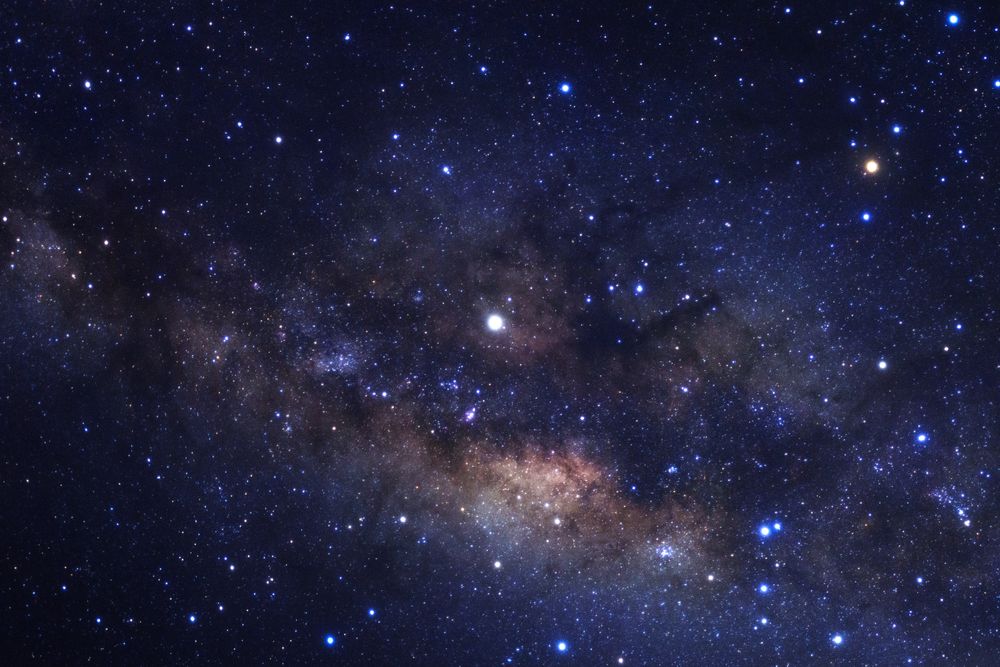 Milky way galaxy with stars and space dust in the universe, Long exposure photograph, with grain.
