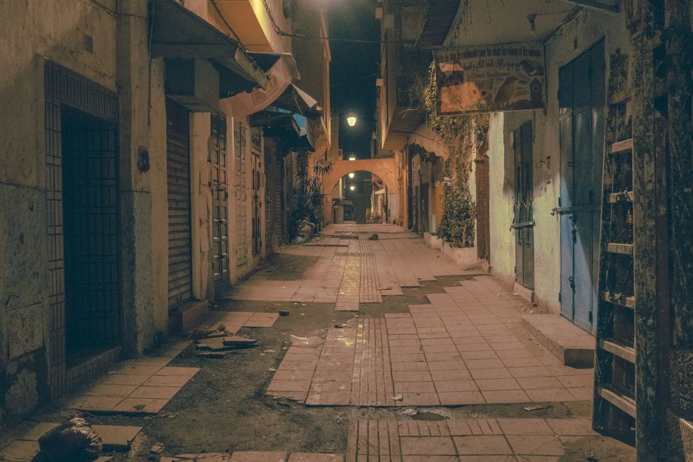 Old narrow street of town at night