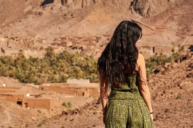 Woman between desert near mountains