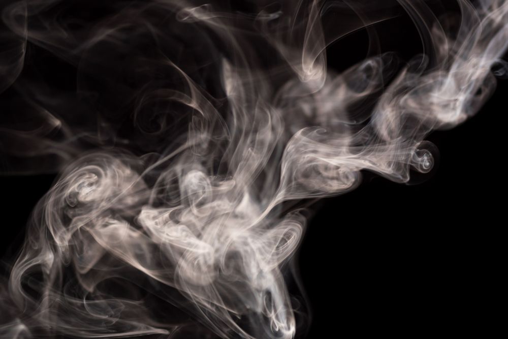 Abstract smoke moving on dark background