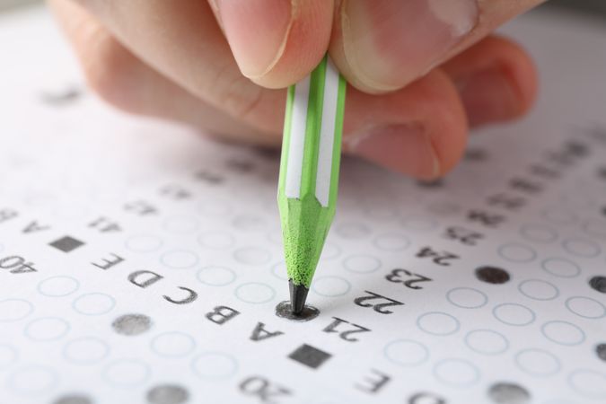 Close up of person pencilling in multiple-choice test