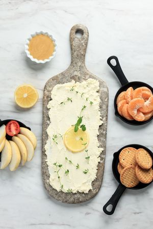 Homemade Trendy Butter Board with Lemon, Biscuits, Orange, Pear.