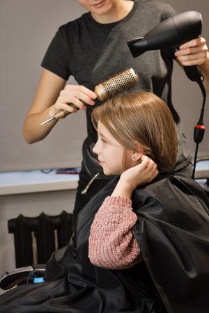 Child Modeling a Bob Haircut
