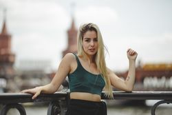 Blonde woman leaning on railing