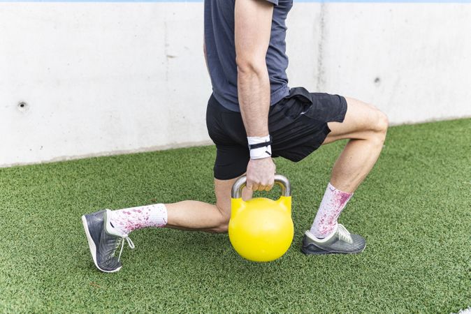 Man training with ball near wall