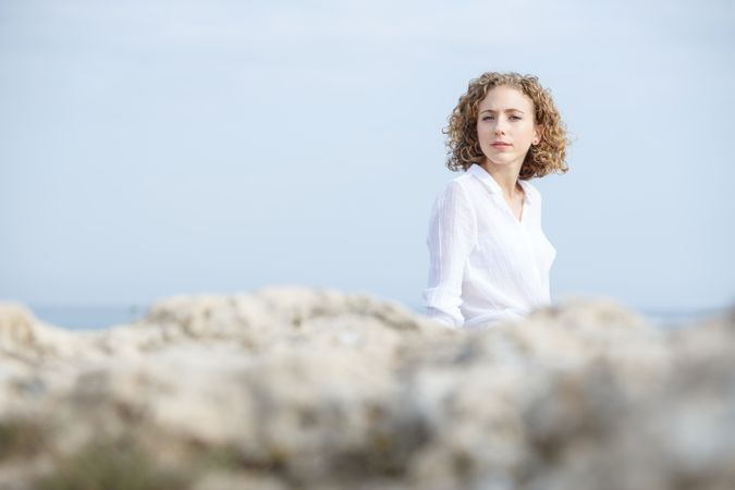 Young pensive woman and blue sky
