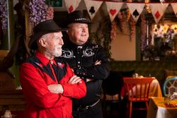 Two happy men in country western attire