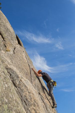 Man climbing a rock