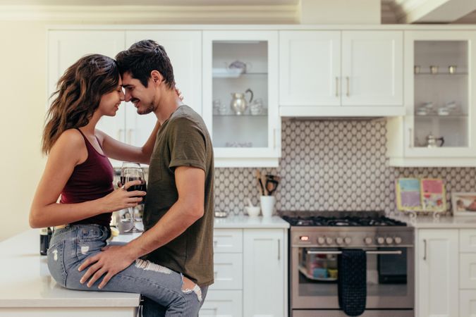 Attractive passionate couple in kitchen