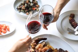 Couple cheering with red wine