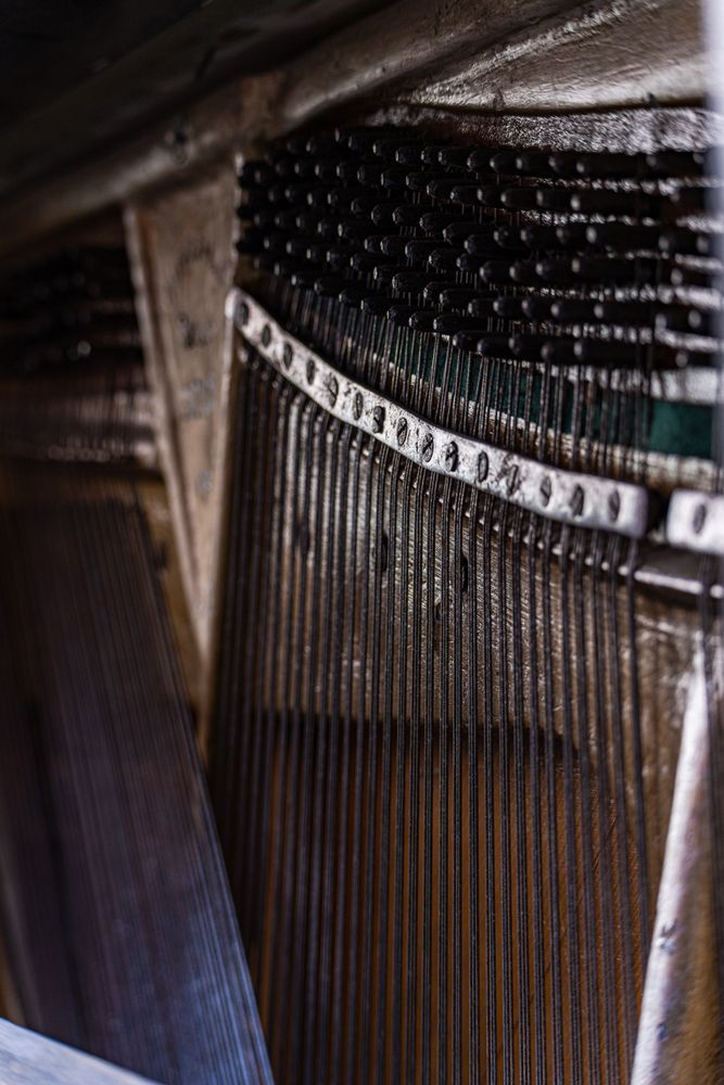 Old destroyed piano instrument close up