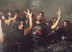 London, England, United Kingdom - Nov 9, 2022: Man and woman enjoying music DJ is playing at event