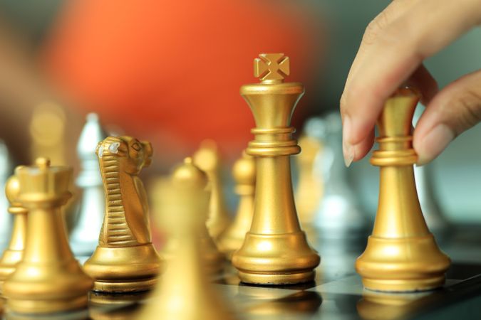 Professional Chess Player Moving a Piece